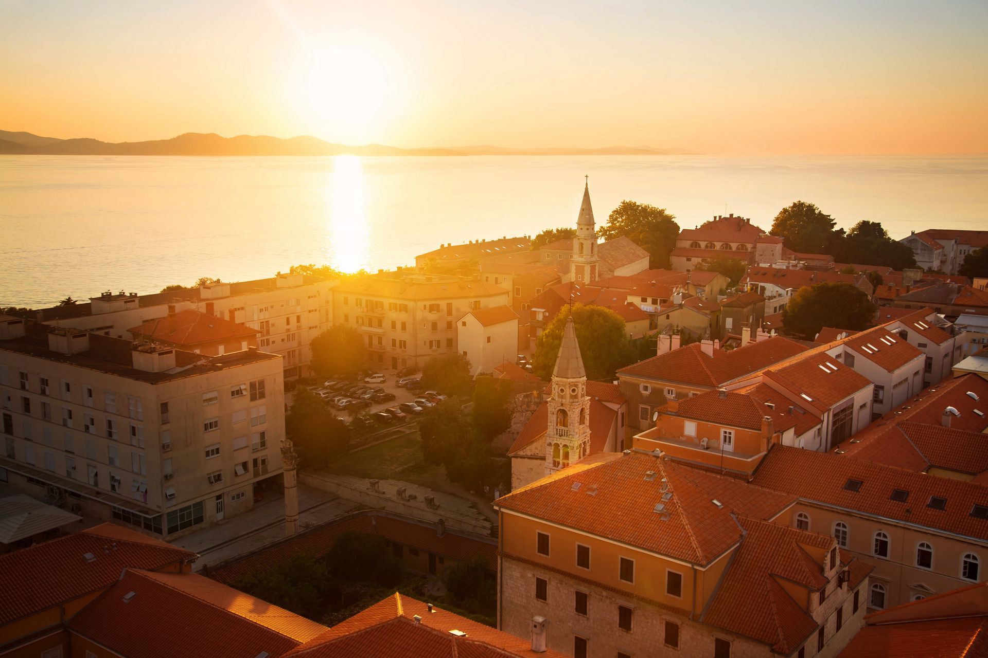 Zadar sunset, the sea and the old city with Almayer Hotel’s neighbourhood viewed from the air 