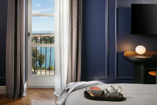 Charming sea and harbour view through the window of Superior double room 'Memento' at Almayer Art & Heritage Hotel's annexe building