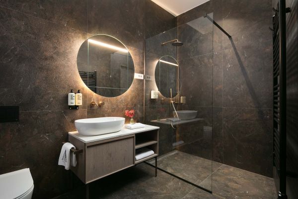 Immerse in subtle ambience: Bathroom of Superior double room 'Memento' at Almayer Art & Heritage Hotel's annexe building, your private spa sanctuary