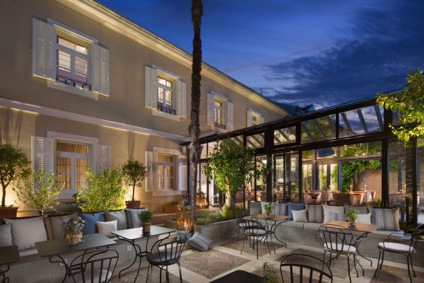 Almayer Art & Heritage Hotel's main building with its secret garden and steel and glass Orangerie at dawn