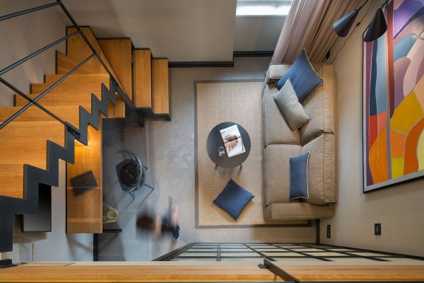 Captivating top view of stairs and living area from the mezzanine level in Deluxe mezzanine double room 'Ostro' at Almayer Art & Heritage Hotel