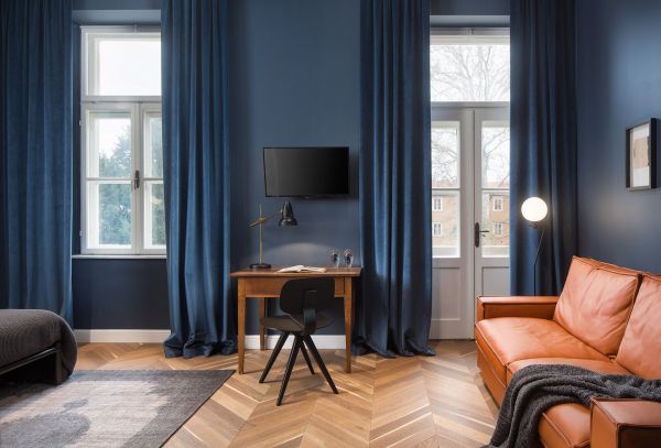 Timeless sophistication in Deluxe double room 'Bianchini' at Almayer Art & Heritage Hotel: Classy and bright interior, the epitome of elegance.