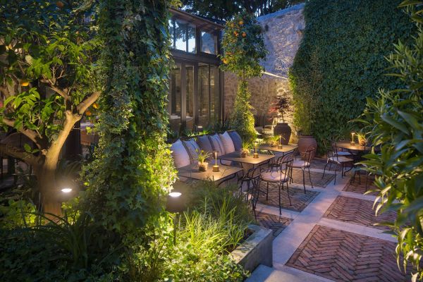 Enchanting evenings on Almayer's terrace: experience the magic of the verdant secret garden ambience