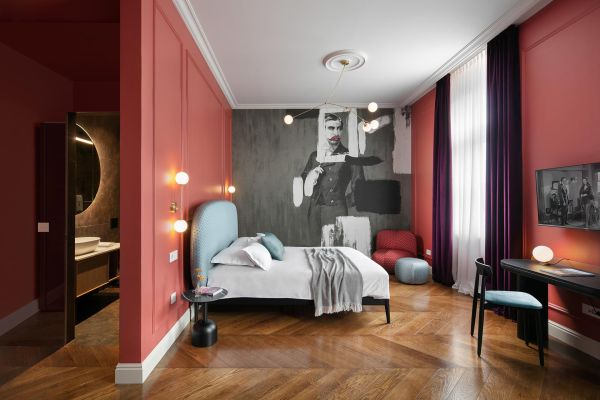 Experience opulence in the deluxe double room 'von Trapp' at Almayer Art & Heritage Hotel's annexe building, featuring a lavish king-sized bed